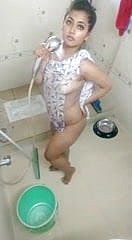 Assamese doll bathing